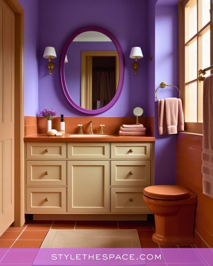 Bold Purple Bathroom With Warm Terracotta and Soft Cream Cabinetry