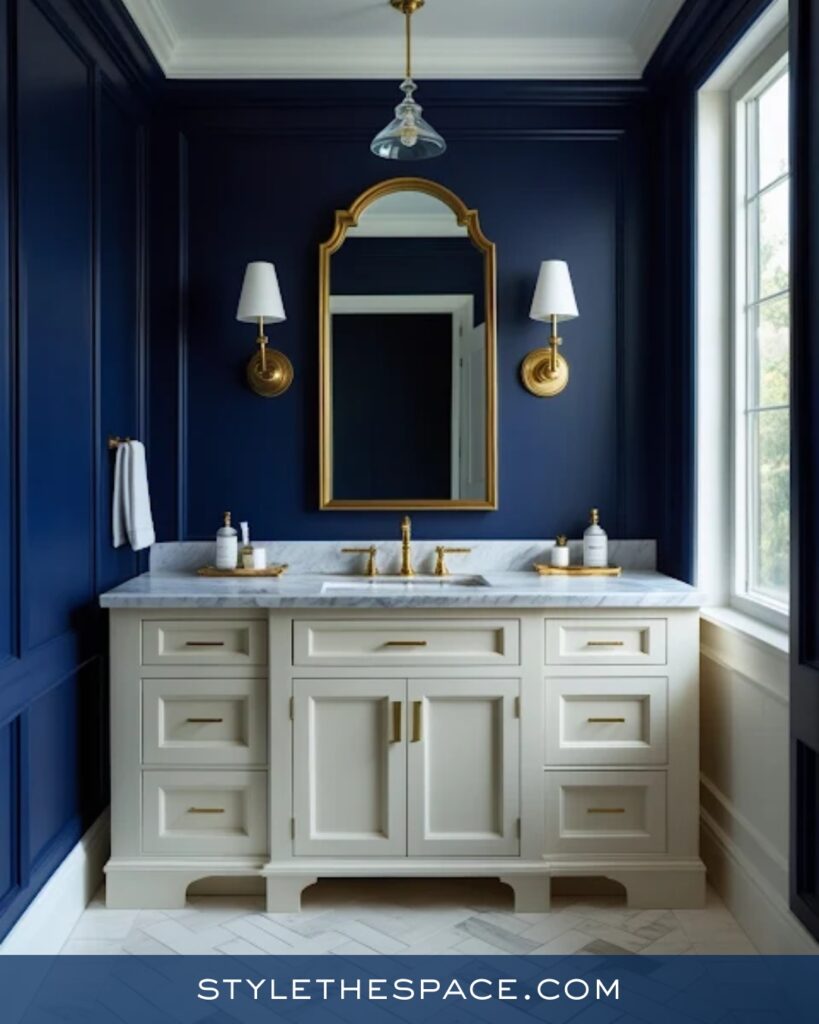 Navy Blue Bathroom With White Vanity and Brass Accents